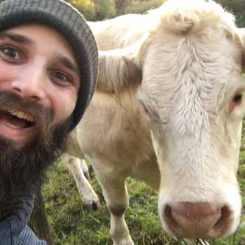 A selfie of myself and a lovely cow next to me