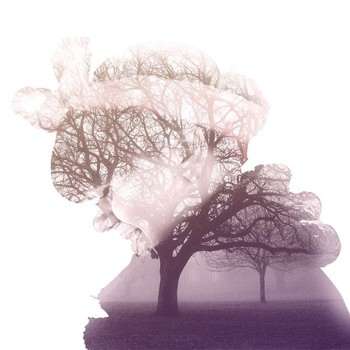 Double exposure image of a girl and some trees
